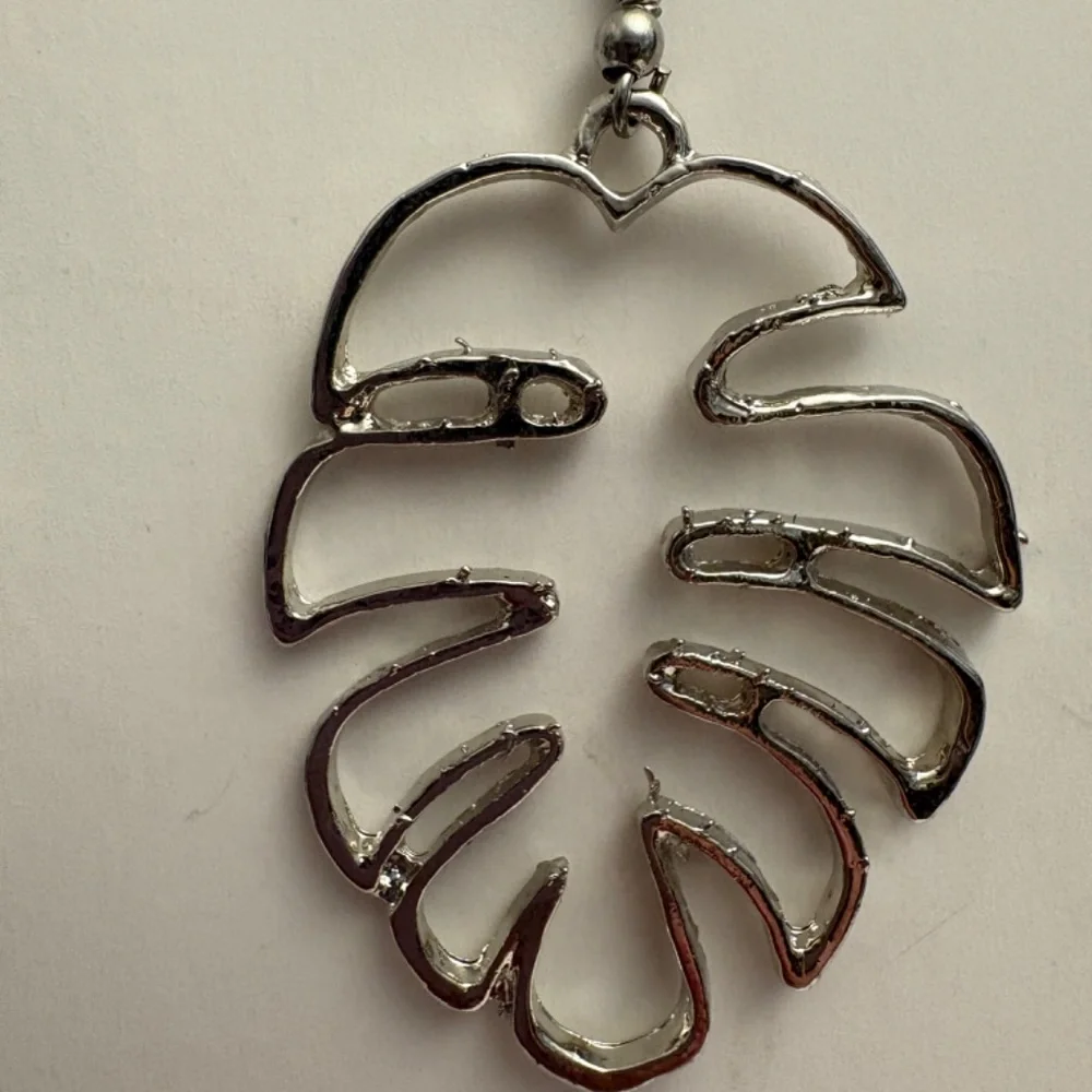 Palm Leaf Earrings in Silvertone.